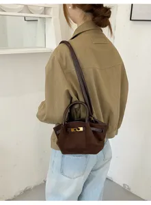 Retro suede shoulder bag with metal lock, chic handbag for women, casual commuting tote.