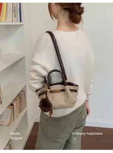 Retro suede shoulder bag for women, large capacity daily tote with metal turn-lock and handle.