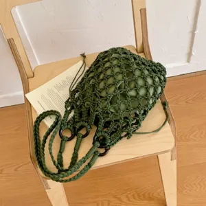 Green cotton macrame woven bucket handbag, stylish niche design hollow net shoulder bag.