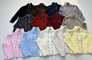 Detailed view of women knitted zip cardigan sweater featuring metal button decoration.
