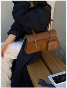 Retro brown suede shoulder bag detail, stylish casual leather handbag with small pouch.