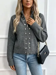 Detailed shot of a women's gray knit zip cardigan with stylish metallic buttons.