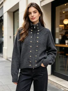 Detail shot of women grey knit cardigan sweater with gold buttons and high collar zipper.