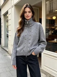 Women's grey knit zip-up cardigan sweater with elegant double-breasted metallic buttons and high collar.
