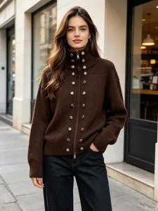 Close-up detail of the women's brown knit cardigan featuring metallic buttons and a high collar.