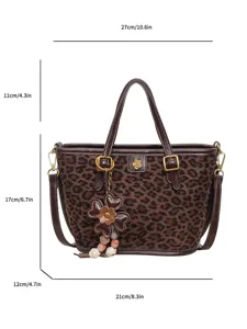 Brown leopard print tote bag with top handles and stylish flower charm detail for women.