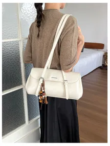 Vintage oil wax leather baguette shoulder bag for women, retro commuting chic armpit handbag.