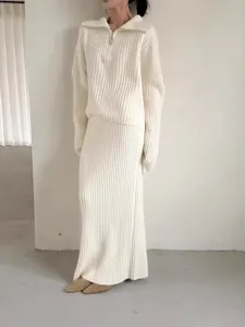 Casual ribbed knit two piece set featuring a half zip sweater and a long skirt for women.