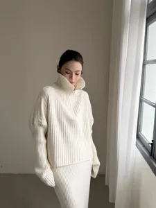 Detail shot of casual ribbed knit half-zip sweater and skirt set in off-white color.