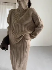 Ribbed knit sweater and skirt set detail, comfortable loose fit, chic high neck fashion style.