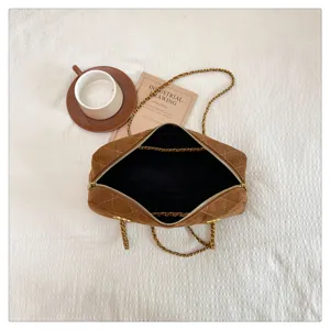 Brown suede quilted shoulder bag detail, vintage chain crossbody bowling bag with black interior.