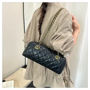 Vintage quilted chain shoulder bag for women, elegant black leather baguette bowling bag.
