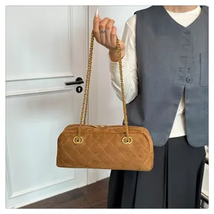 Brown suede quilted shoulder bag detail, stylish chain strap and premium vintage design.