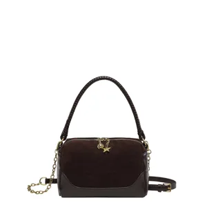 Brown suede pillow shoulder bag with braided handle, gold chain and star charm detail.