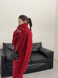 Detail shot of red ribbed knit half-zipper sweater and skirt set, cozy autumn wear.