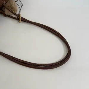 Brown leather shoulder bag strap handle detail view, premium daily commute handbag accessory.