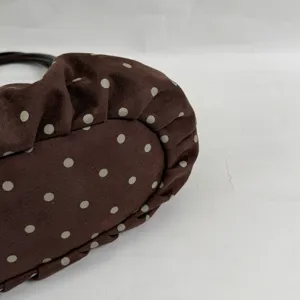 Brown polka dot shoulder bag detail, soft suede material with elegant pleated edges stylish.