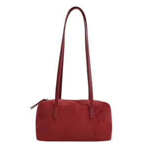 Red suede pillow shoulder bag with long straps, elegant underarm bag for daily wear and commuting.
