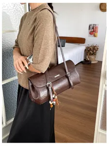 Vintage brown oil leather baguette shoulder bag for women retro underarm commuter bag.
