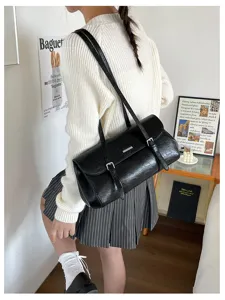 Retro oil wax leather baguette shoulder bag for women, chic vintage commuting daily handbag.