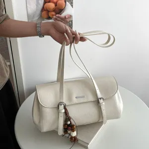 White oil wax leather baguette shoulder bag for women, retro commuter fashion handbag.