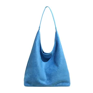 Blue suede hobo shoulder bag detail view, soft fabric texture and minimalist strap design.