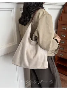 Vintage suede hobo shoulder bag for women, casual minimalist commuting tote handbag.
