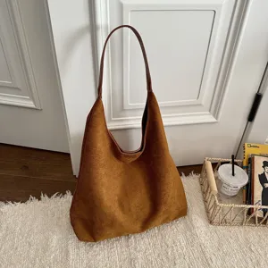 Vintage brown suede hobo shoulder bag for women, stylish minimalist commuter handbag.