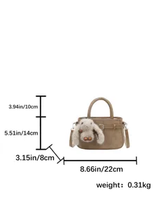 Detailed view of retro suede mini handbag showing dimensions and plush bunny pendant charm.