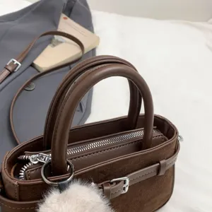 Vintage brown suede handbag with top handle and zipper closure, chic minimalist daily tote bag.