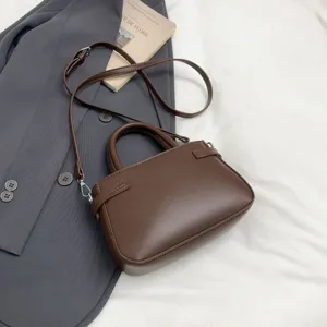 Retro brown top handle shoulder bag minimalist PU leather small square handbag for women.