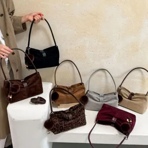 Vintage suede underarm shoulder bag chic casual hobo handbag with cute pom-pom charm.