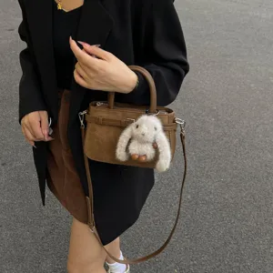 Vintage suede handbag for women, chic crossbody shoulder bag with cute plush bunny charm.