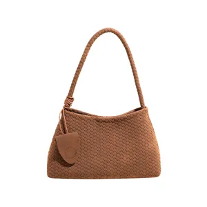 Braune geflochtene unterarmtasche minimalistischer retro stil lederhandtasche elegante tasche