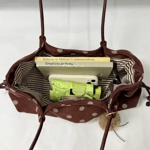 Brown polka dot tote bag large capacity casual shoulder bag with striped inner lining and pom pom.