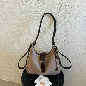 Casual retro suede shoulder bag, large capacity hobo handbag with buckle and charms.