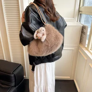 Fluffy plush shoulder bag for women, cozy winter cloud hobo purse with cute bunny charm.