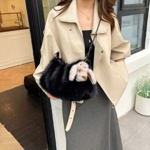 Black faux fur shoulder bag with cute fluffy bunny pendant, stylish crossbody cloud bag for women.