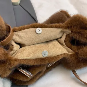 Brown faux fur shoulder bag interior detail, luxury stylish design with metal hardware.