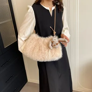 Detailed view of fluffy plush shoulder bag showcasing soft texture and cute bunny charm.