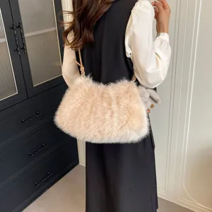 Detailed view of fluffy faux fur shoulder bag worn by model, soft plush texture design.