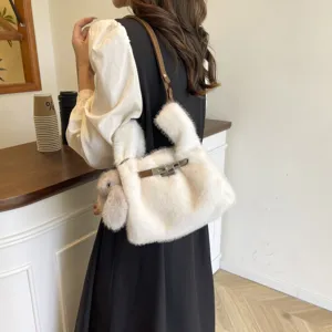 Korean style fluffy plush shoulder bag with metal lock and cute rabbit charm for daily use.