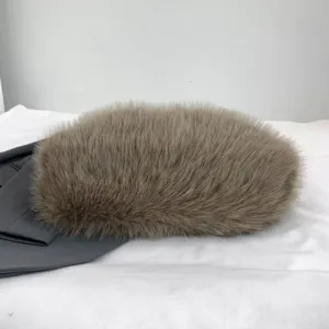 Detailed close-up view of brown plush faux fur cloud handbag, showing soft texture.