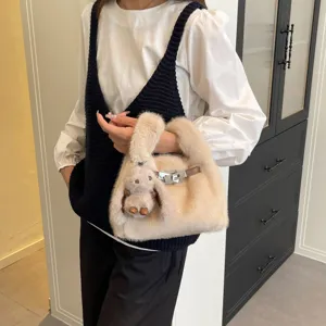 Plush faux fur handbag with chic metal lock closure and cute plush pendant design stylish