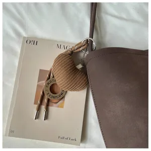 Vintage brown large capacity tote bag with woven heart pendant for daily commute