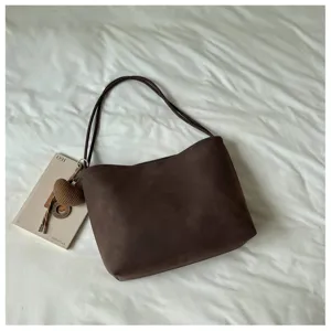 Dark brown suede retro shoulder bag with double straps and heart knit pendant for daily commute.
