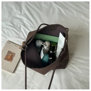 Minimalist brown large capacity tote bag for women, chic casual shoulder commuting bag.