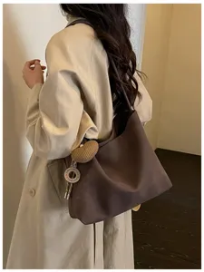 Minimalist large capacity retro tote bag for women, elegant commuter shoulder handbag.