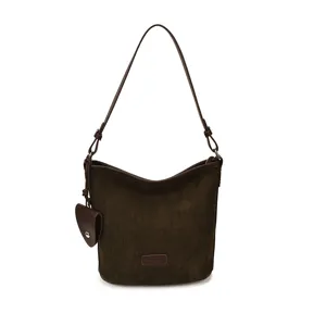 Brown suede bucket bag detail showing soft texture, adjustable strap and small accessory pouch.