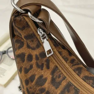 Detailed view of the leopard print shoulder bag showcasing the premium zipper and texture.
